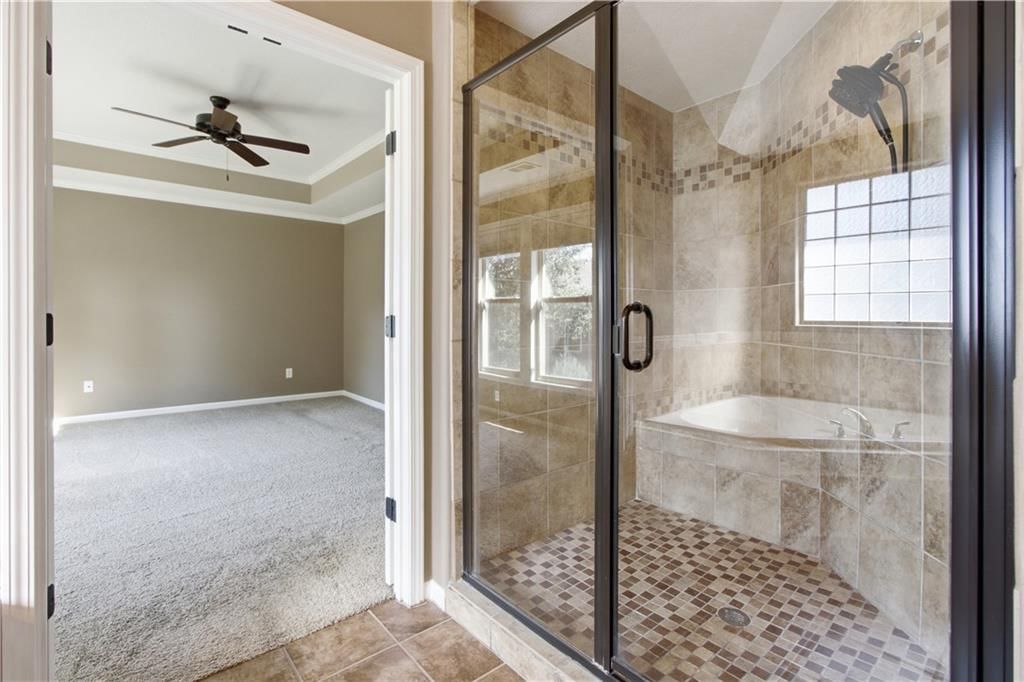 Walk-in shower and tiled shower at 11454 S Lakecrest Drive, Olathe, KS 66061