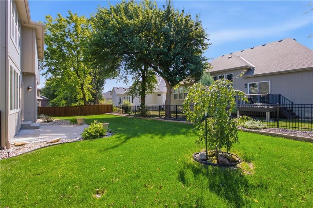 Big backyard, fenced yard and mature trees at 11454 S Lakecrest Drive, Olathe, KS 66061