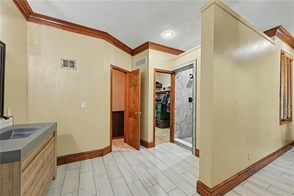 Tiled shower and frameless glass shower at 8225 NW Weatherby Drive, Weatherby Lake, MO 64152