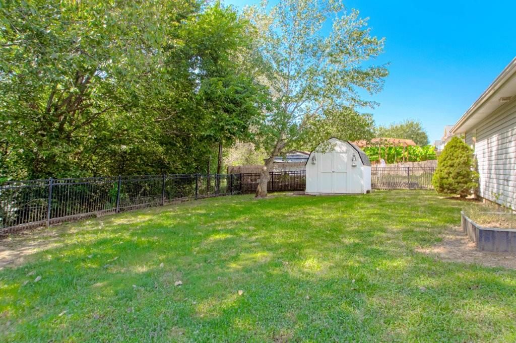 Fenced yard at 603 Creek Ridge Drive, Grain Valley, MO 64029