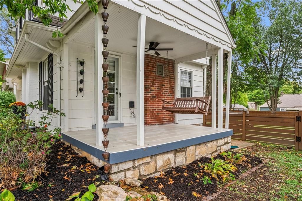 Covered front porch and concrete driveway at 5233 Nall Avenue, Roeland Park, KS 66202