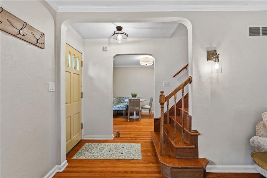 Hardwood floors, staircase and white trim at 5233 Nall Avenue, Roeland Park, KS 66202