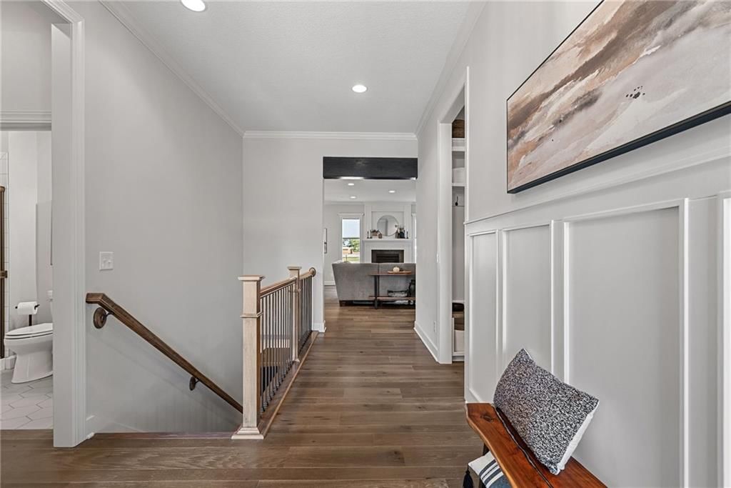 Hardwood floors, staircase and iron stair railing at 25048 W 112th Terrace, Olathe, KS 66061