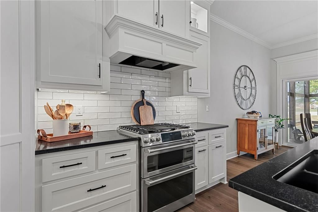 Kitchen island, white kitchen and quartz counters at 25048 W 112th Terrace, Olathe, KS 66061
