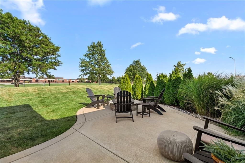 Screened porch, covered patio and concrete patio at 25048 W 112th Terrace, Olathe, KS 66061