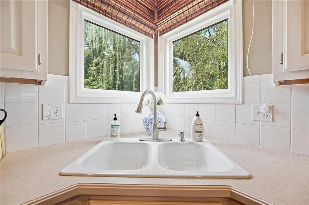 Walk-in shower, double oven and tiled shower at 16150 W 156th Place, Olathe, KS 66062
