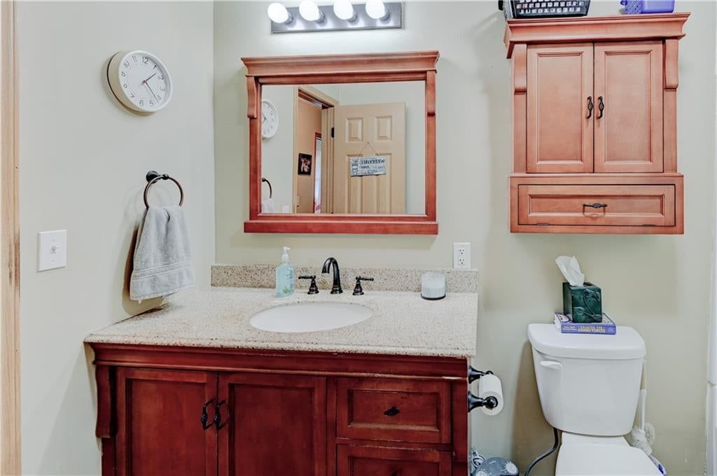 Double vanity, wood vanity and renovated bathrooms at 805 Citadel Drive, Weston, MO 64098