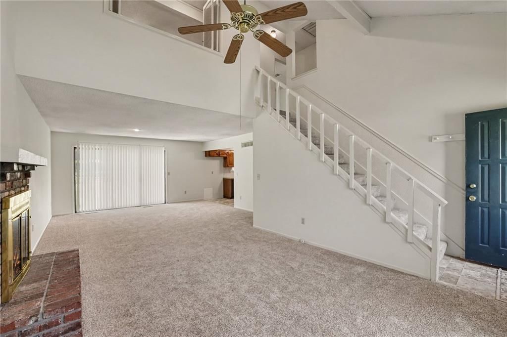 Tall ceilings, fireplace and brick fireplace at 7507 Long Avenue, Lenexa, KS 66216