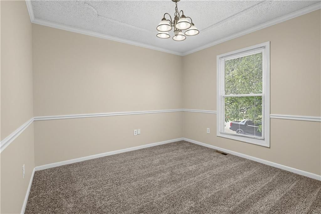 Wainscoting or board and batten, shiplap / paneling and accent wall at 2129 Sunset Circle, Pleasant Hill, MO 64080