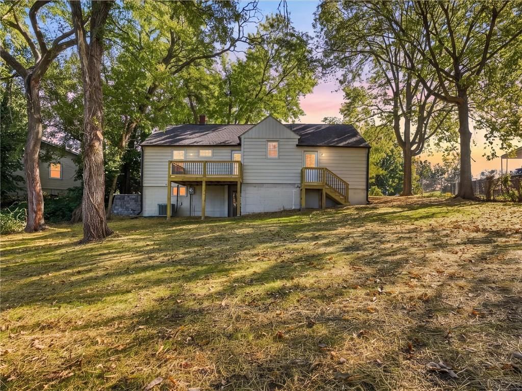 Big backyard, mature trees and flat lot at 204 Westview Place, Excelsior Springs, MO 64024