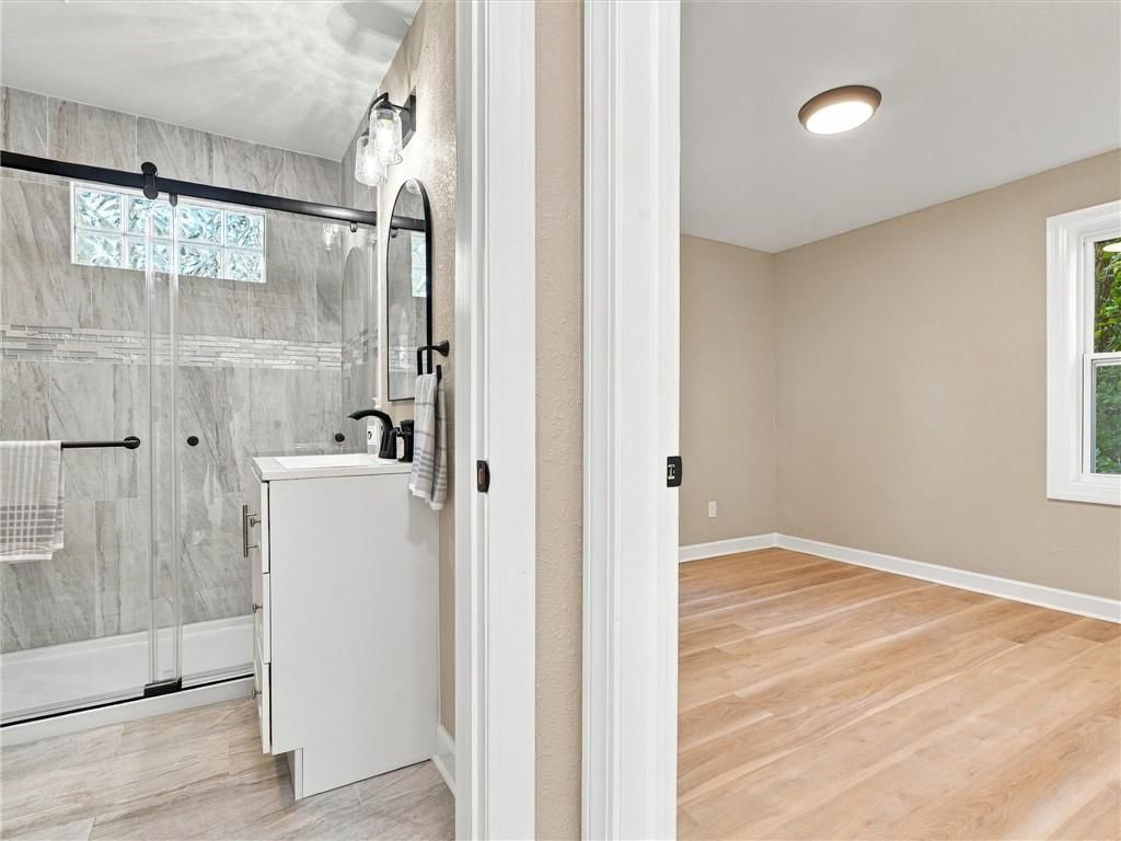 Walk-in shower, tiled shower and frameless glass shower at 204 Westview Place, Excelsior Springs, MO 64024