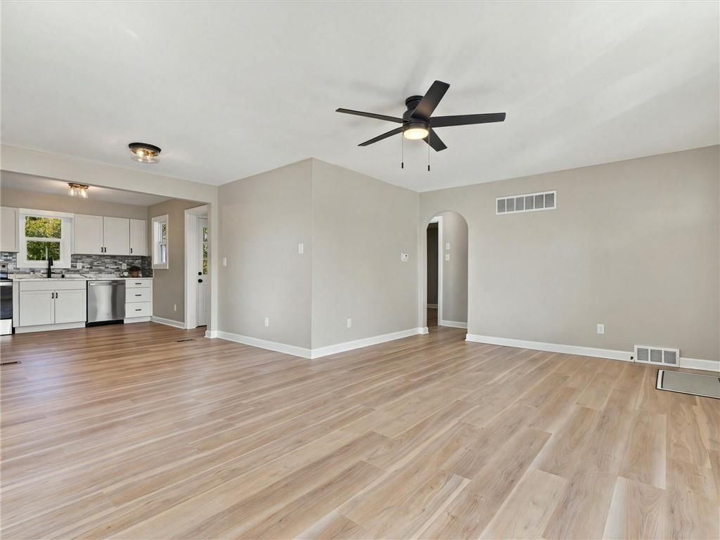 Open floor plan, luxury vinyl floors and black hardware at 204 Westview Place, Excelsior Springs, MO 64024