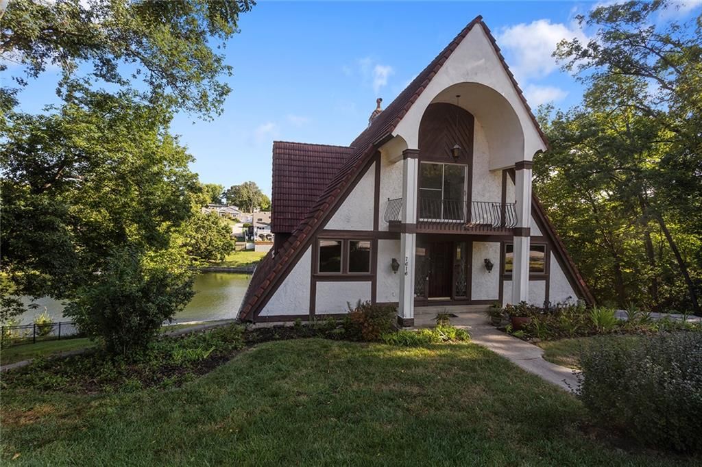 Lake visible from the property and mature trees at 7616 NW Eastside Drive, Weatherby Lake, MO 64152