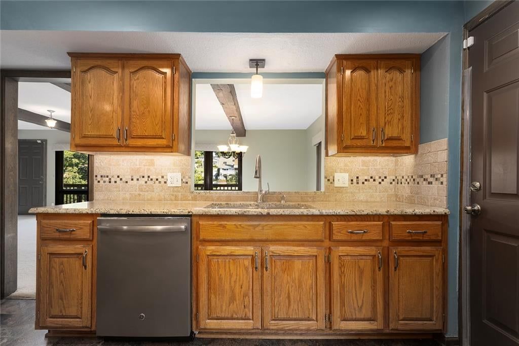 Granite counters, double oven and stainless steel appliances at 7616 NW Eastside Drive, Weatherby Lake, MO 64152