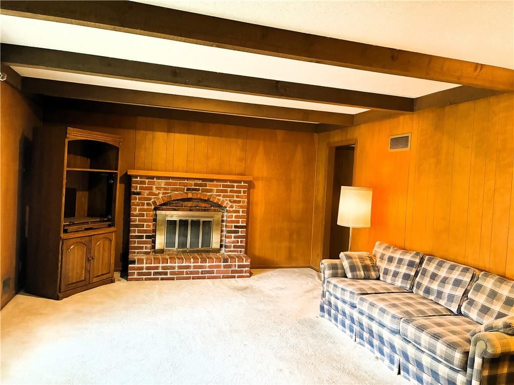 Fireplace and ceiling beams at 1212 SW Horizon Drive, Blue Springs, MO 64015