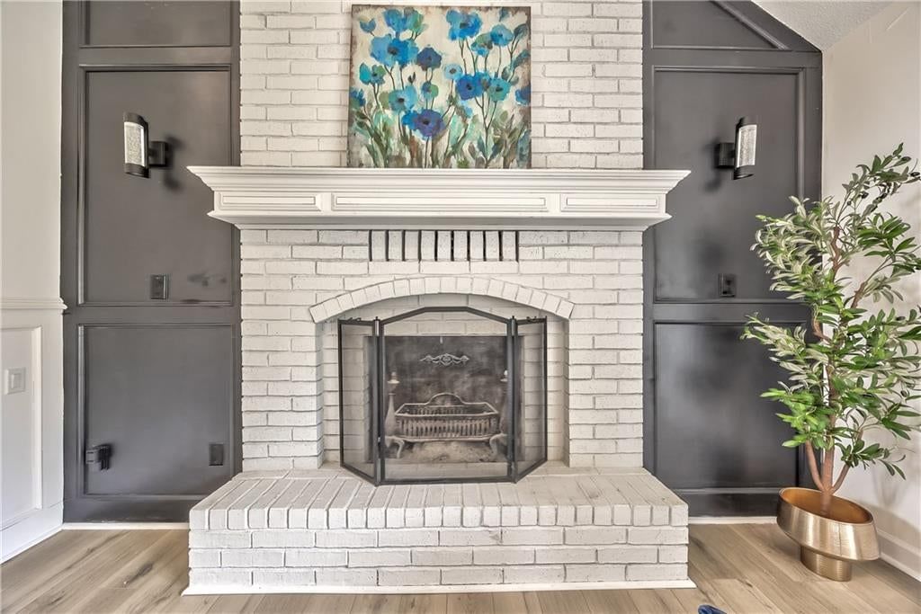 Fireplace and black hardware at 1105 Brookside Place, Raymore, MO 64083