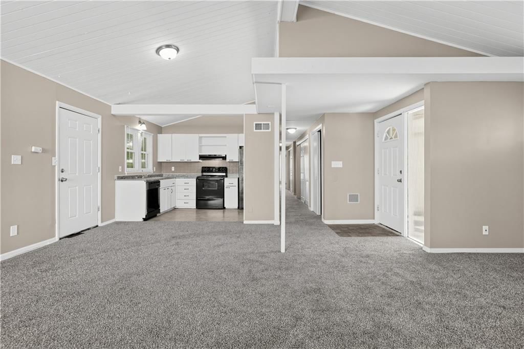 Tall ceilings, open floor plan and white kitchen at 7415 W 61st Street, Overland Park, KS 66202