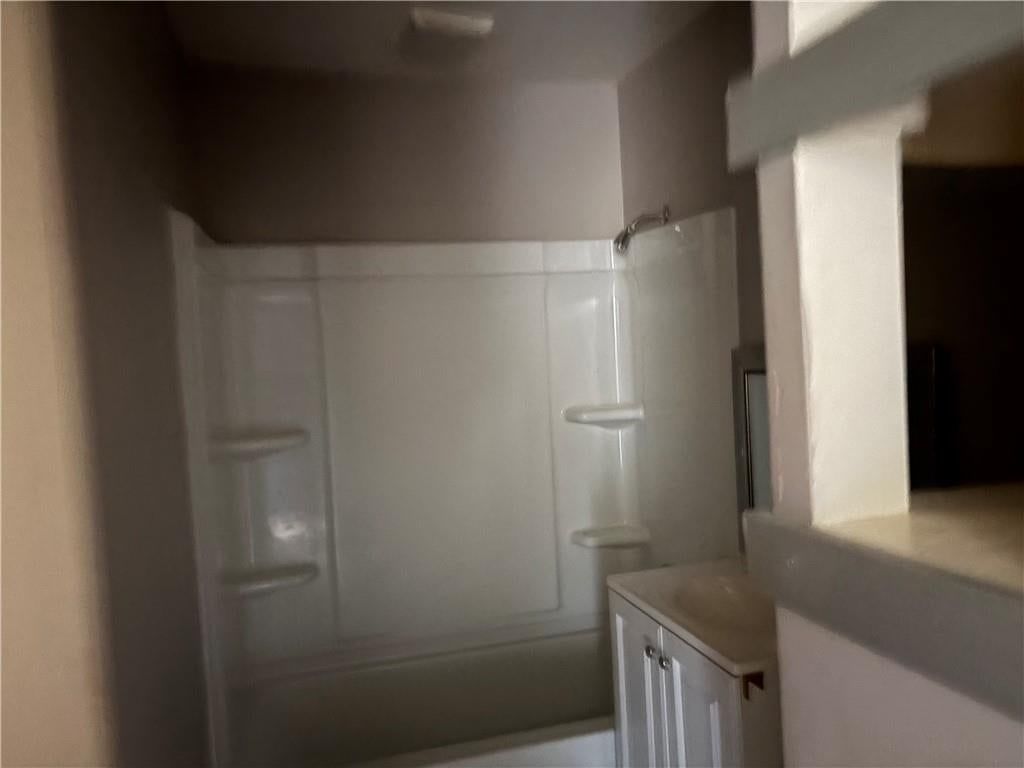 Tiled shower and frameless glass shower at 4724 N Bristol Avenue, Kansas City, MO 64117