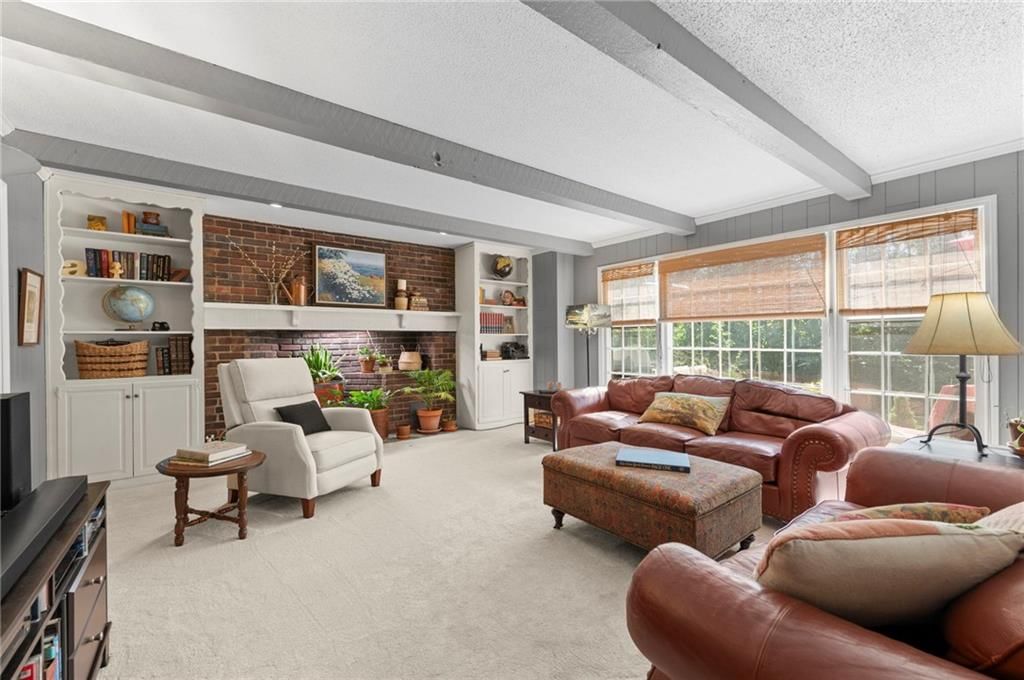 Exposed brick wall, shiplap / paneling and ceiling beams at 12846 Sagamore Road, Leawood, KS 66209