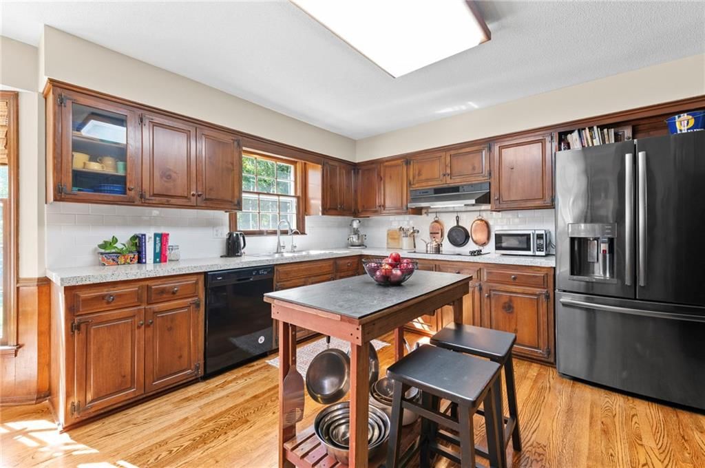 Kitchen island and kitchen backsplash at 12846 Sagamore Road, Leawood, KS 66209
