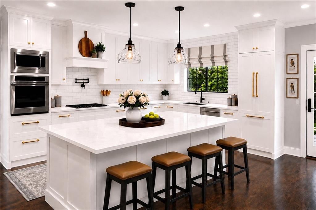 Kitchen island, white kitchen and quartz counters at 17090 Smith Road, Smithville, MO 64089