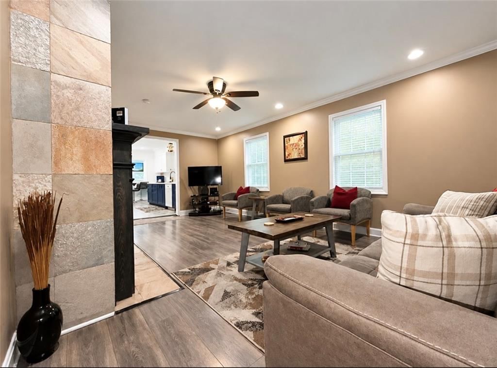 Fireplace and open floor plan at 5417 Paseo Boulevard, Kansas City, MO 64110