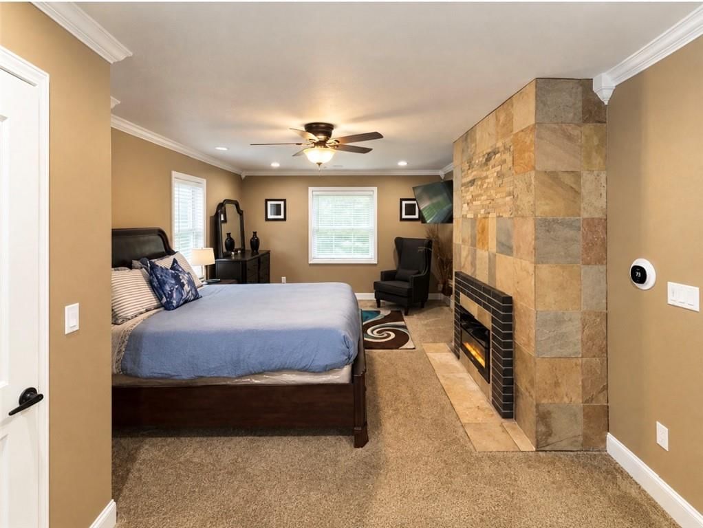 Freestanding tub, double vanity and bedroom sitting area at 5417 Paseo Boulevard, Kansas City, MO 64110