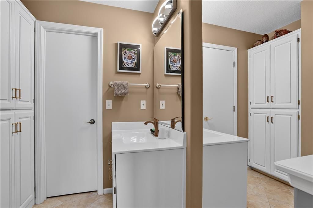Walk-in shower, freestanding tub and tiled shower at 12200 E 89th Street, Kansas City, MO 64138