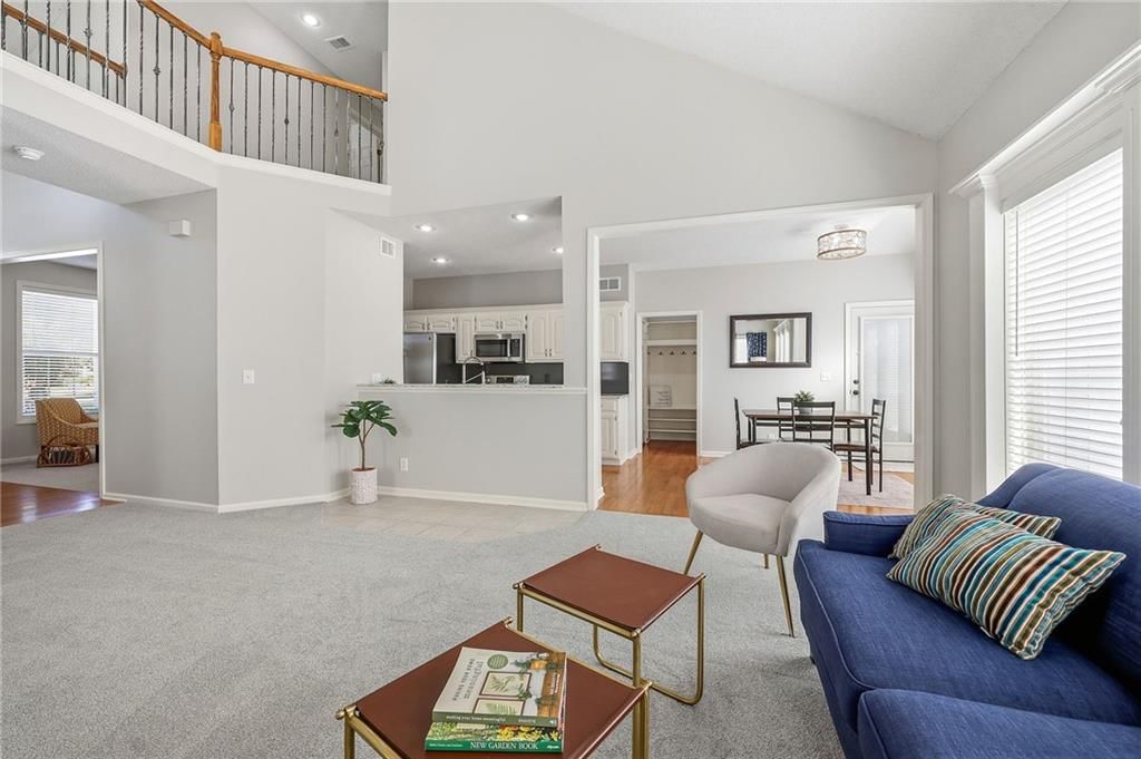 Open floor plan and wall of windows at 2325 W Piatt Lane, Olathe, KS 66061