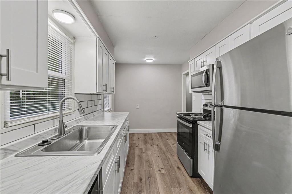 Photo 4: stainless steel appliances, 8605 Spring Valley Road, Raytown, MO 64138
