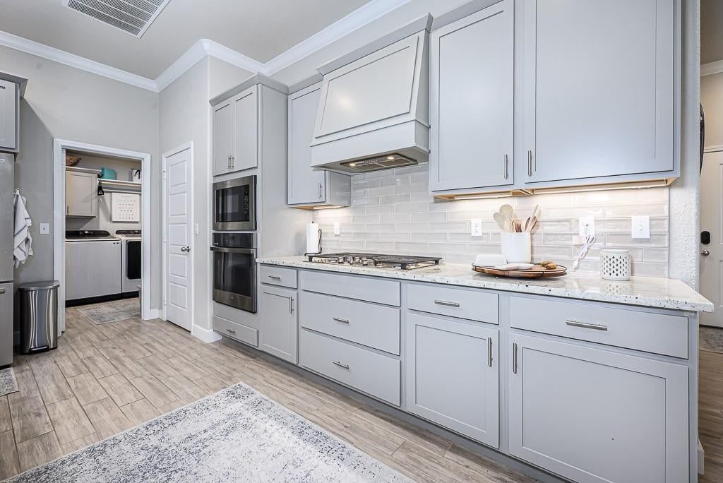 Modern, open floor plan and kitchen island at 24315 W 76th Street, Shawnee, KS 66227