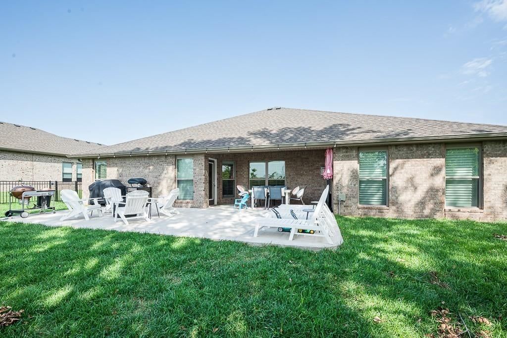 Big backyard, fenced yard and covered patio at 24315 W 76th Street, Shawnee, KS 66227
