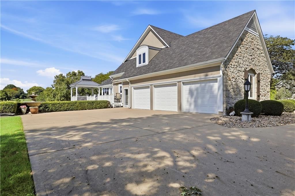 Garage for three or more cars and attached garage at 15592 S Greenwood Street, Olathe, KS 66062