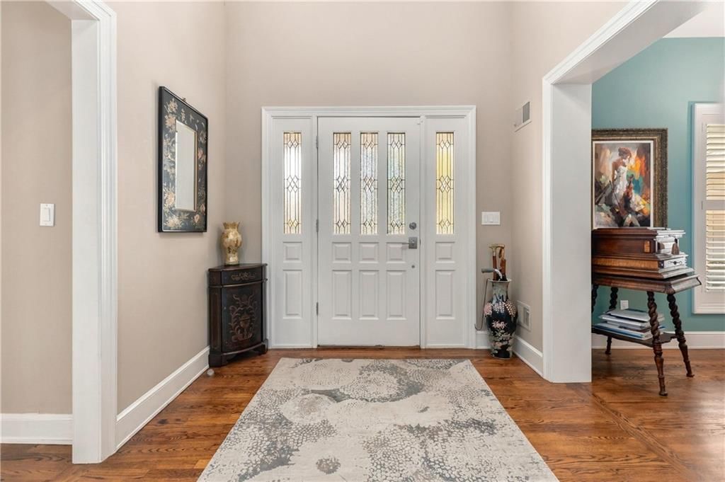 Hardwood floors, staircase and wood stair railing at 15592 S Greenwood Street, Olathe, KS 66062