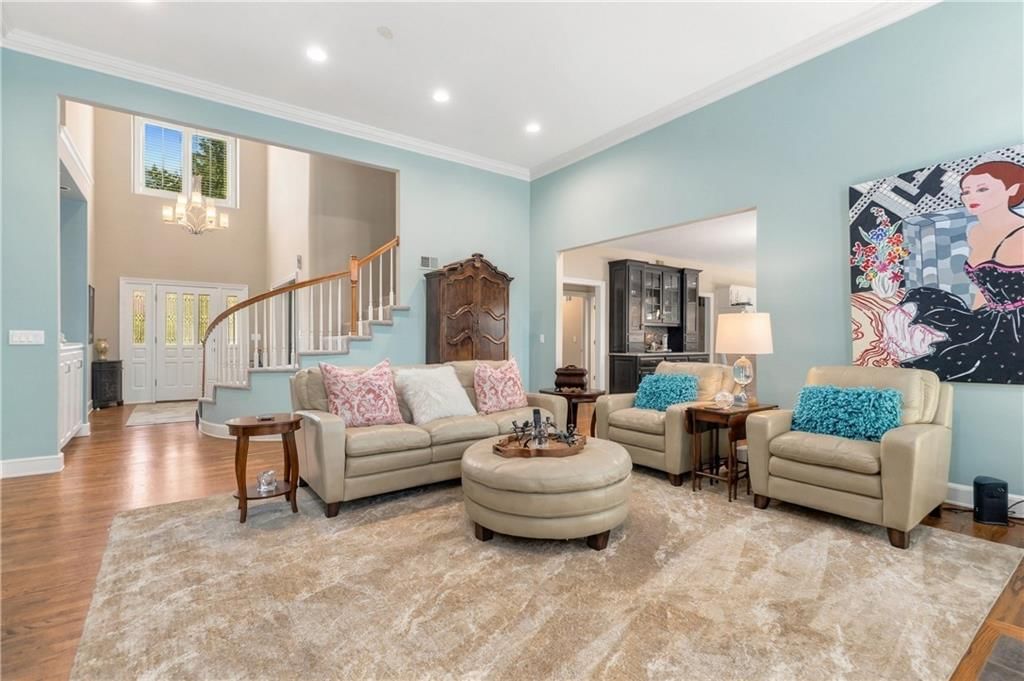 Tall ceilings, open floor plan and statement lighting at 15592 S Greenwood Street, Olathe, KS 66062