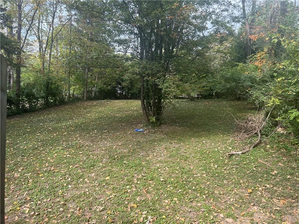 Big backyard and mature trees at 1836 E 77th Street, Kansas City, MO 64132