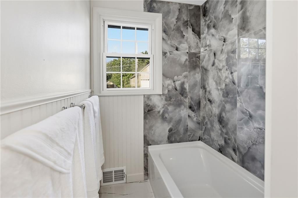 Tiled shower at 5909 Melrose Lane, Shawnee, KS 66203