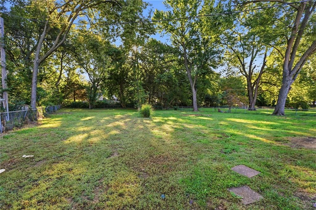 Big backyard, fenced yard and mature trees at 5909 Melrose Lane, Shawnee, KS 66203