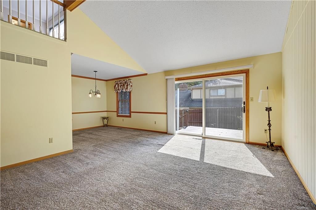 Tall ceilings, fireplace and open floor plan at 9623 Reeder Street, Overland Park, KS 66214