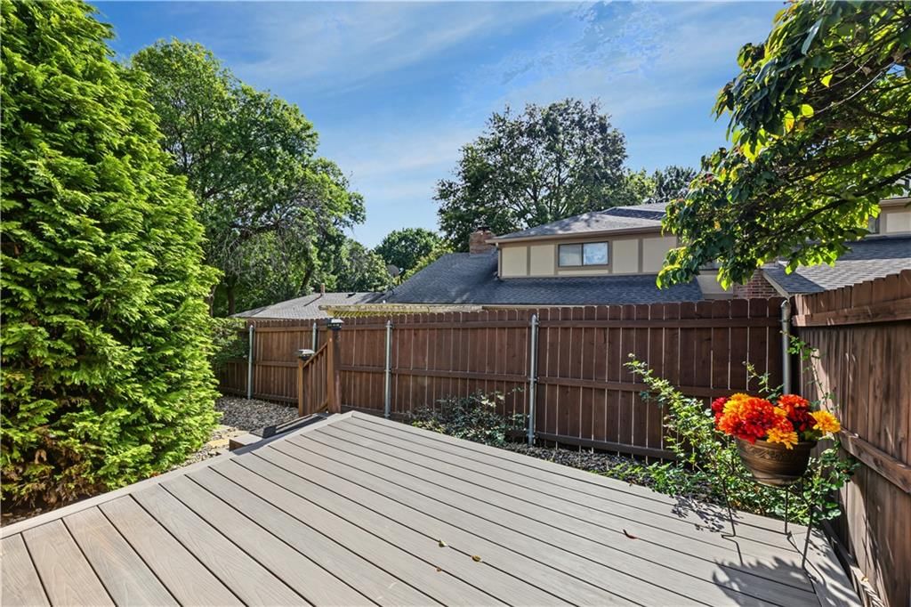 Deck, fenced yard and wood fence at 9623 Reeder Street, Overland Park, KS 66214