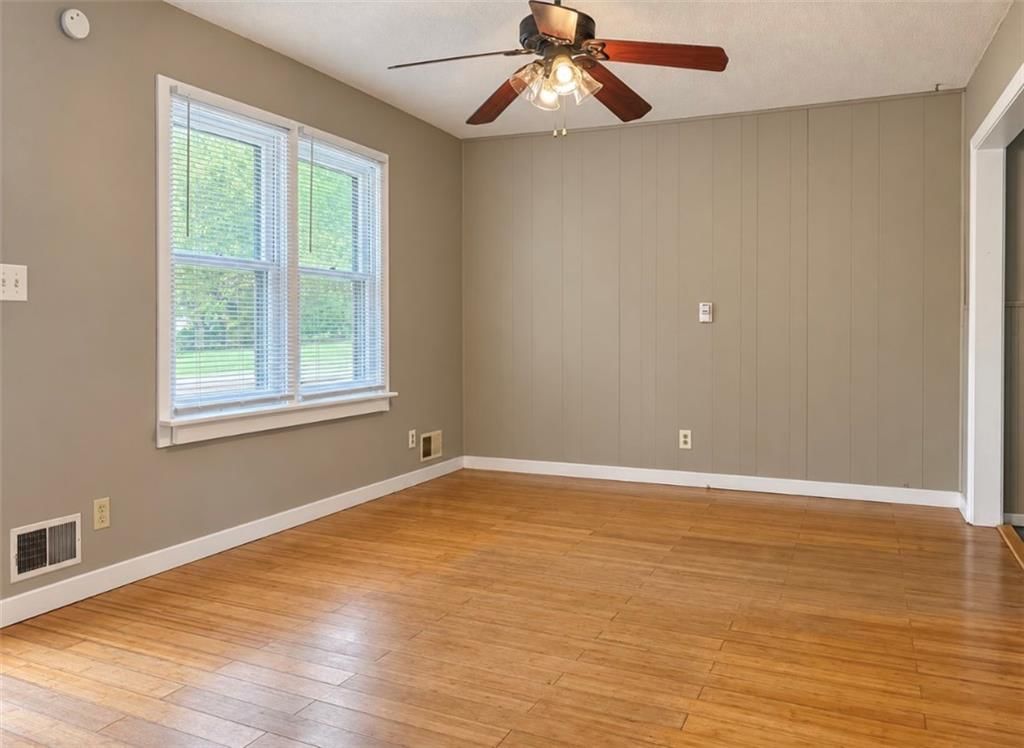 Hardwood floors, luxury vinyl floors and shiplap / paneling at 11806 E 58th Street, Kansas City, MO 64133