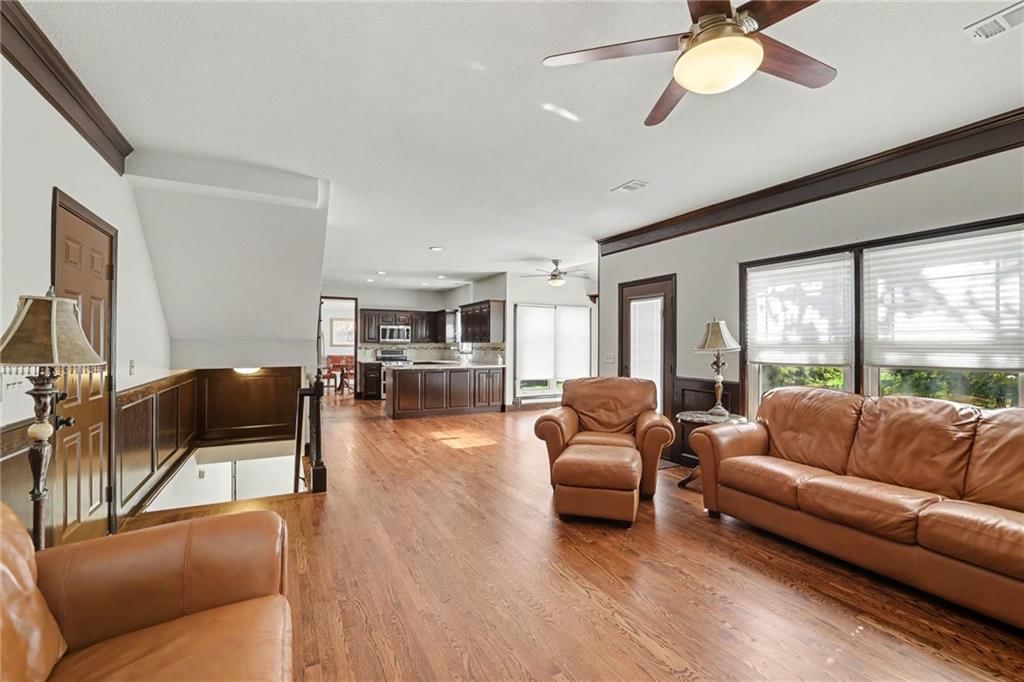 Fireplace and open floor plan at 9913 W 125th Terrace, Overland Park, KS 66213