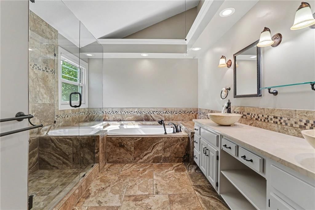 Walk-in shower, tiled shower and frameless glass shower at 9913 W 125th Terrace, Overland Park, KS 66213