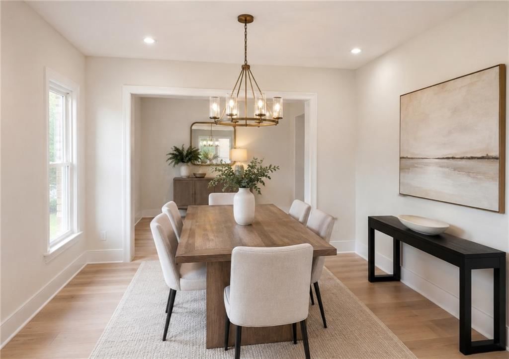 Tall ceilings, statement lighting and wall of windows at 10009 W 70 Terrace, Merriam, KS 66203