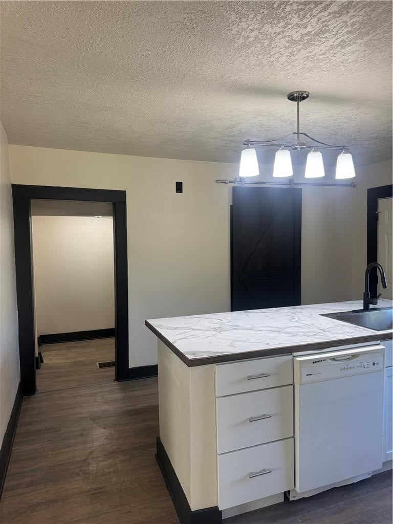 Kitchen island, white kitchen and updated kitchen at 547 Orchard Place, Excelsior Springs, MO 64024