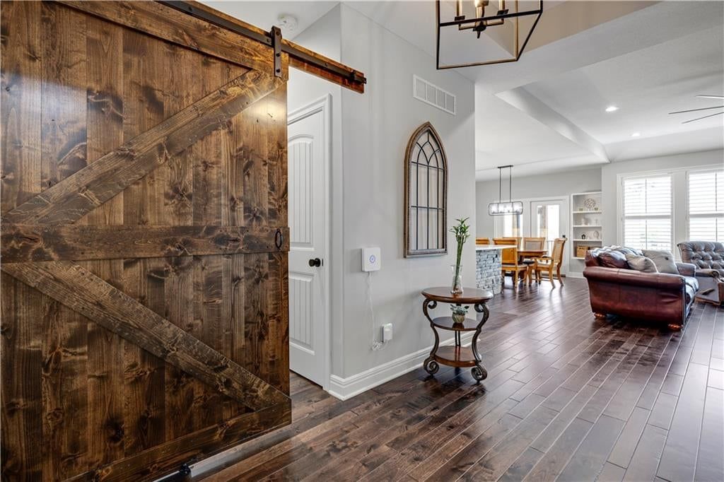 Hardwood floors, white trim and white walls at 8311 Pickering Street, Lenexa, KS 66227
