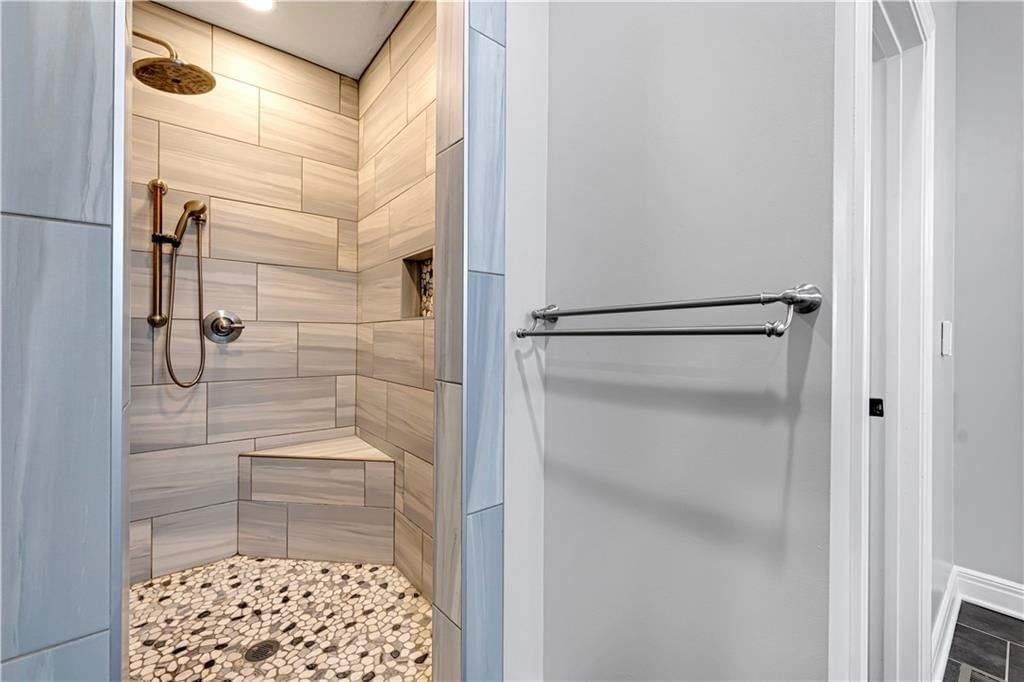Walk-in shower, tiled shower and frameless glass shower at 8311 Pickering Street, Lenexa, KS 66227