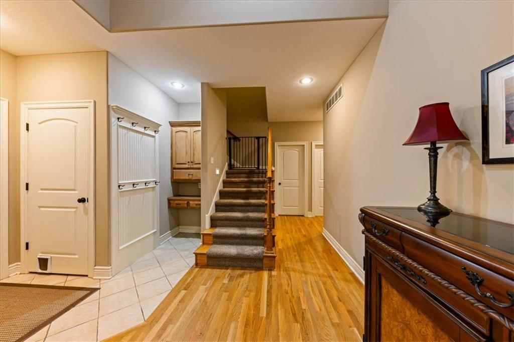 Mudroom built-ins, staircase and iron stair railing at 23716 W 52nd Terrace, Shawnee, KS 66226