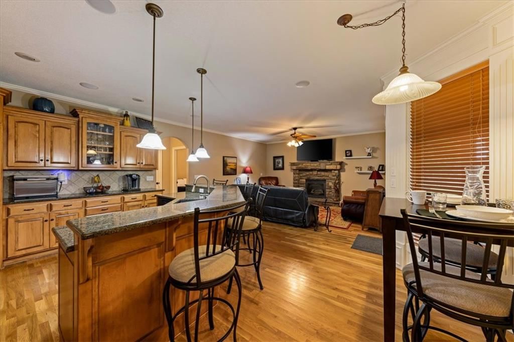 Open floor plan, kitchen island and breakfast nook at 23716 W 52nd Terrace, Shawnee, KS 66226