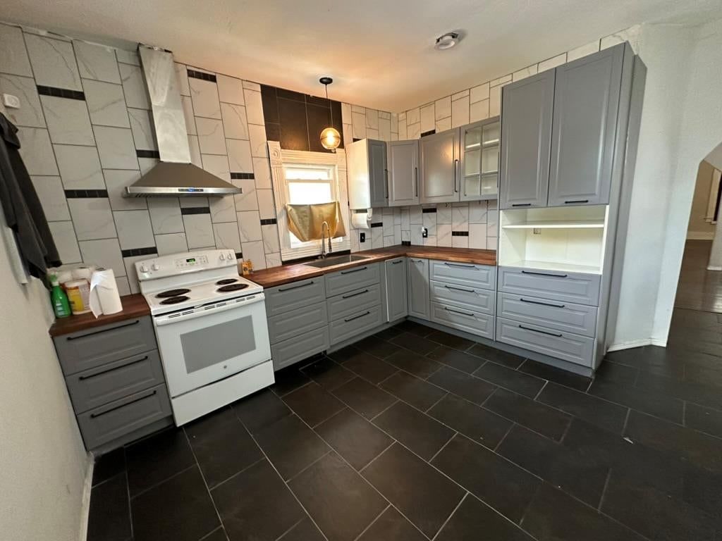 Gray kitchen cabinets, shaker cabinets and updated kitchen at 2807 7th Street E, Kansas City, MO 64124